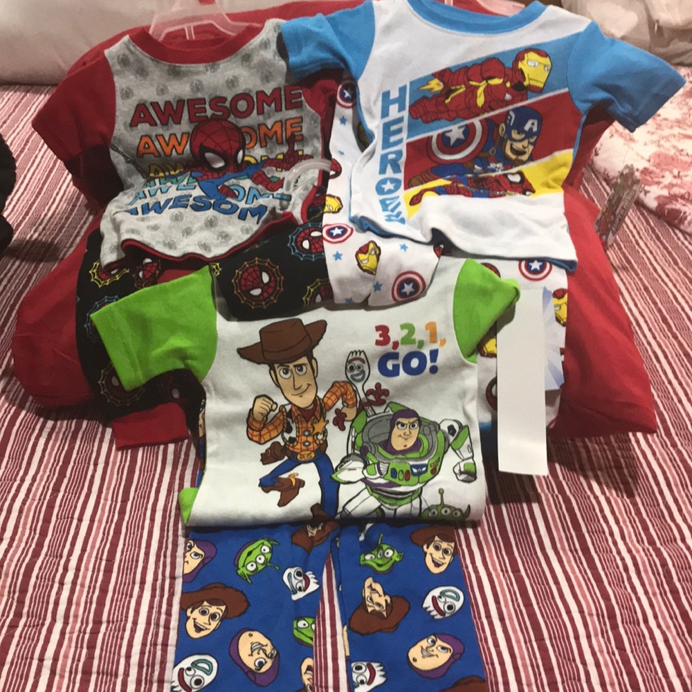 Three pair of superhero pajamas